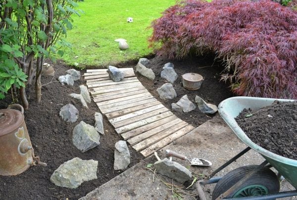  garden walkway dismantled wooden slats stones 