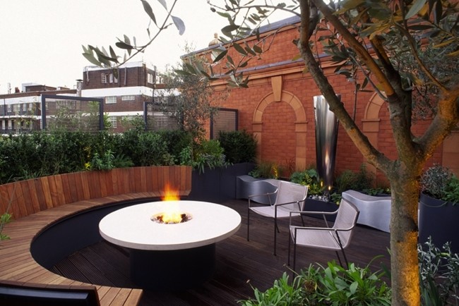 roof terraces round wooden bench hearth lush plantings