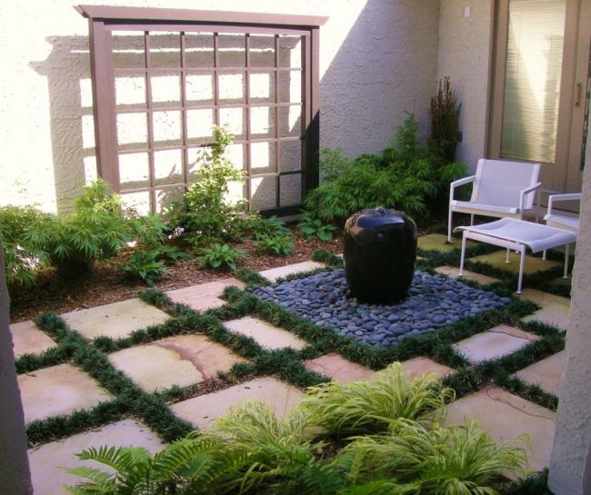 design ideas for terraces fountain gravel base stone grass