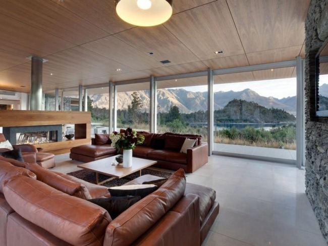 living room picture windows overlooking the lake in New Zealand House