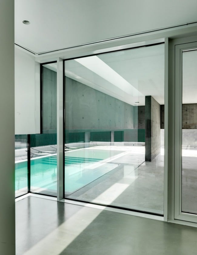 single family Italy indoor pool exposed concrete interior wall design
