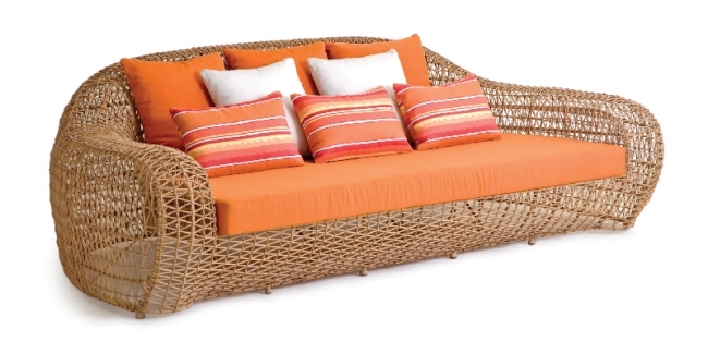 orange sofa rattan furniture by Kenneth Cobonpue
