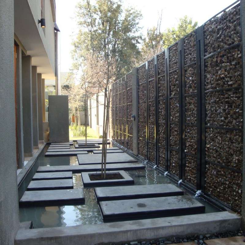 Gabion Fence itself-build and concrete paving stones-pond
