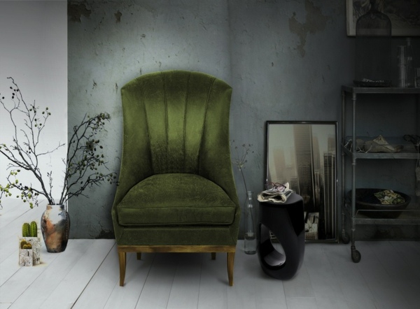 eleganter-grüner-Sessel-gepolstert-schwarzer-Kaffeetisch
