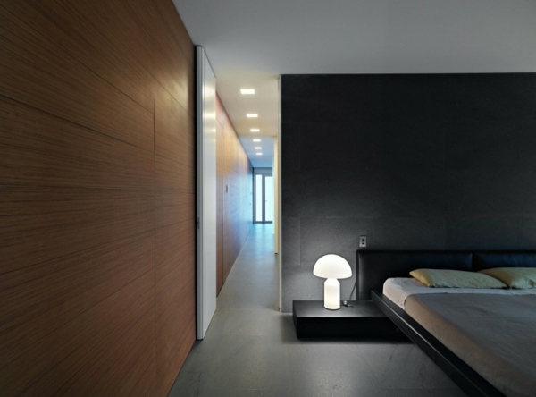 Schlafzimmer schwarze Wand Doppelbett minimalistische Einrichtung Ideen