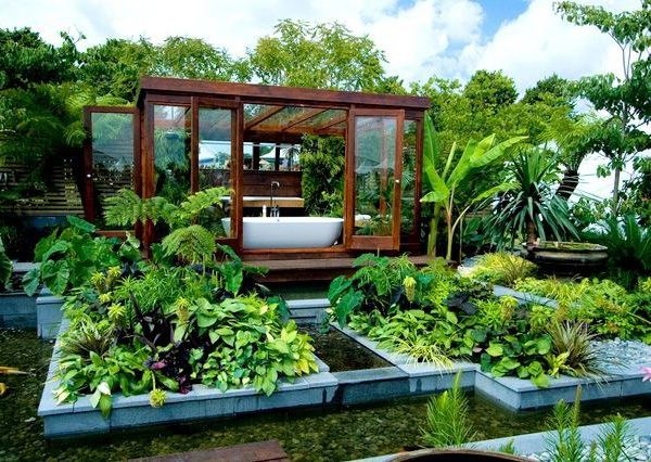 landschaftsbau wasser kies palmen gartenhaus badewanne