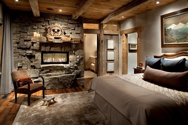 wohnideen schlafzimmer design rustikal beige steinwand kamin