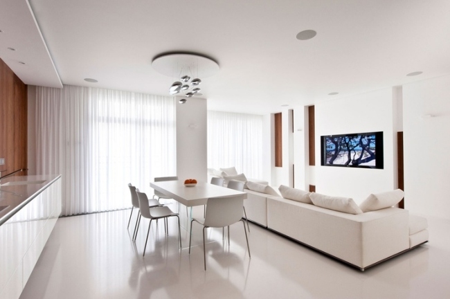 wohnzimmer küche in einem weiß hochglanz minimalistisch