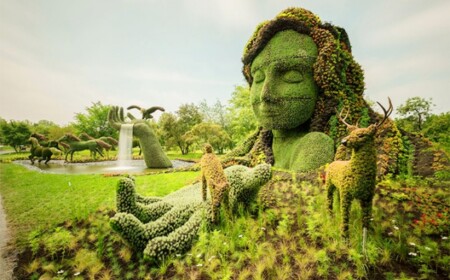 Frau mit Hirschen-Skulptur Blumen-Montreal kanada-Wettbewerb Gartenkunst