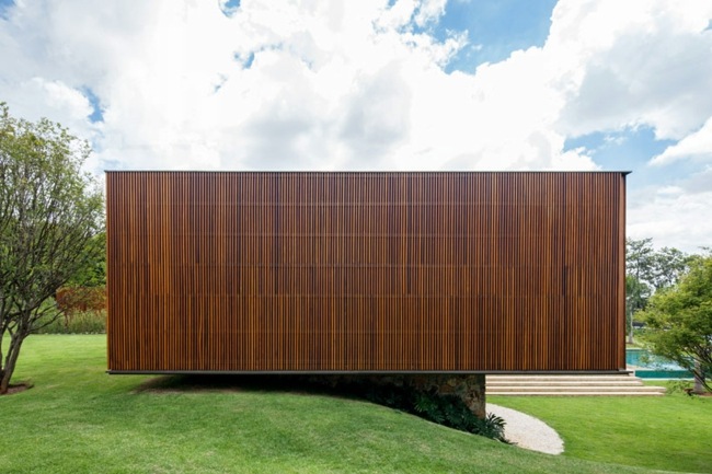 Architektur Massivhaus Natursteinbasis Holz Fassaden Gestaltung