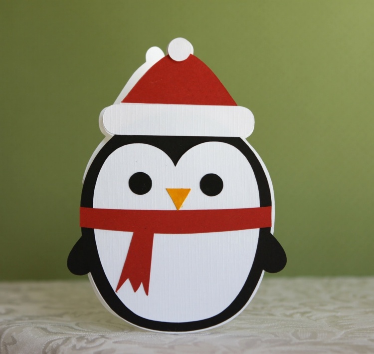 weihnachtsdeko mit kindern basteln pinguin karte idee weihnachtsmann-muetze
