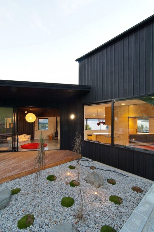 Design Haus-Pultdach Holz Terrasse Verglasung-Steingarten Innenhof-Gestaltung