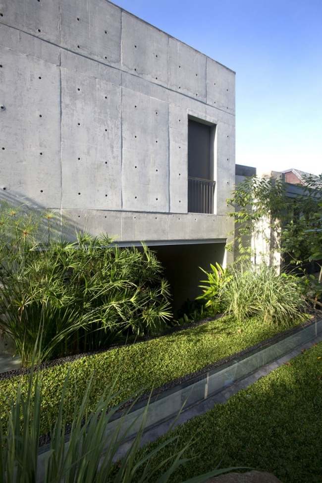 modernes mehrfamilienhaus stahlbeton fassade chang architekten landschaftsbau