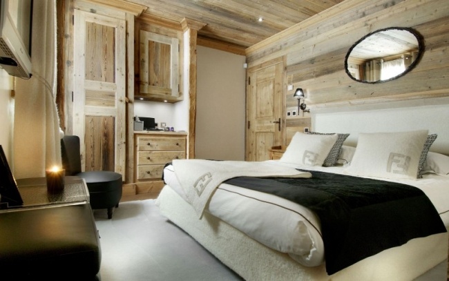 Luxus-Skihütte alpen chalet schlafzimmer holz verkleidung doppelbett
