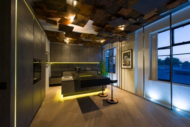 Wohnung mit moderner Einrichtung küche beton kochinsel beleuchtung