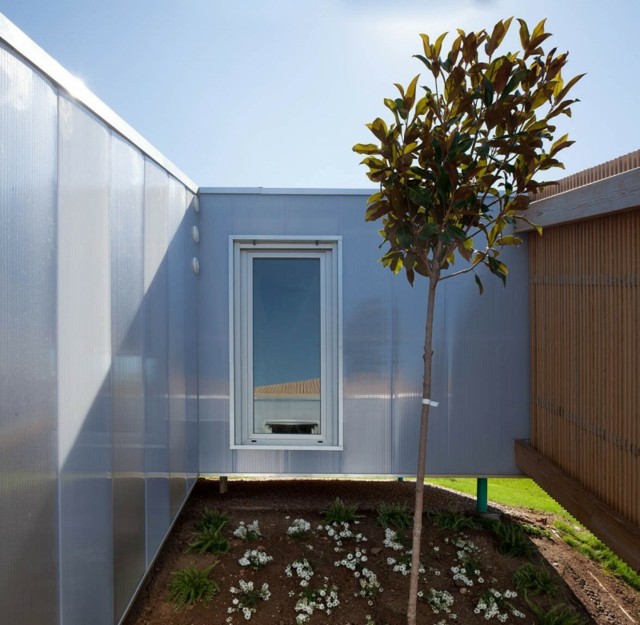 Garten Gestaltung Fenster Metall Holz moderner Neubau