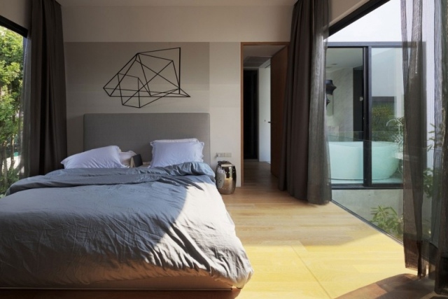 modernes schlafzimmer glaswand sonnenlicht minimalistisch