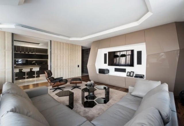 Wohnzimmer Einrichtung-ecksofa grau futuristisches wanddesign relax sessel fußlehne