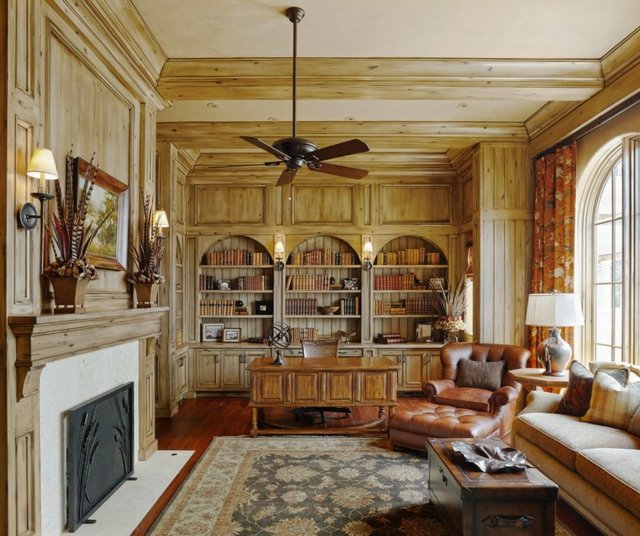 klassische Wandgestaltung eingebaute Bücherregale Holz Teppich