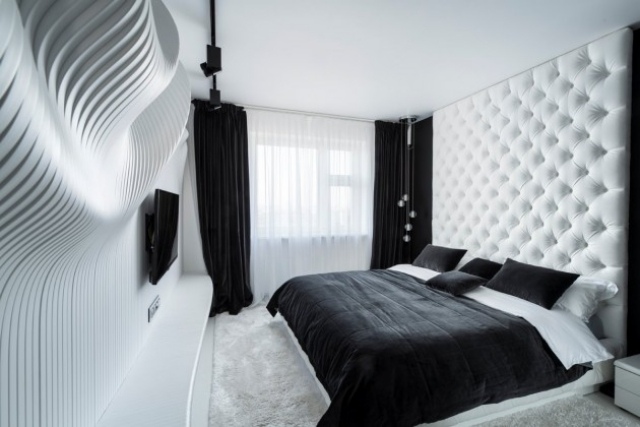 kleines schlafzimmer schwarz weiß wanddeko gesteppter bett kopfteil