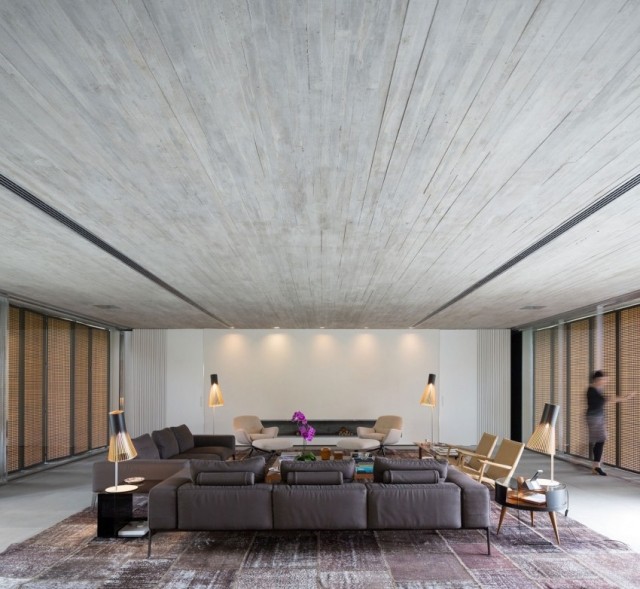 wohnzimmer design modernes offenes-raumkonzept teppichboden vintage-look-ledersofa