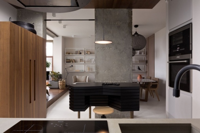 Einbauküche-mit-Kochinsel-Design-schwarz-Stein-Holzschränke-Trennwand-Beton