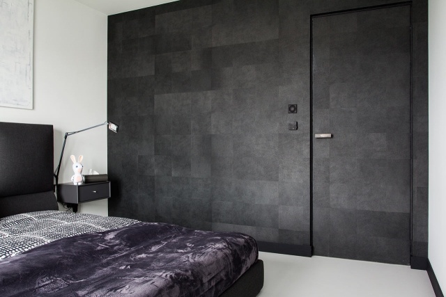 Schlafzimmer moderne monochrome wohnung Wand Beton Optik-dunkel grau-rahmenlose-tür