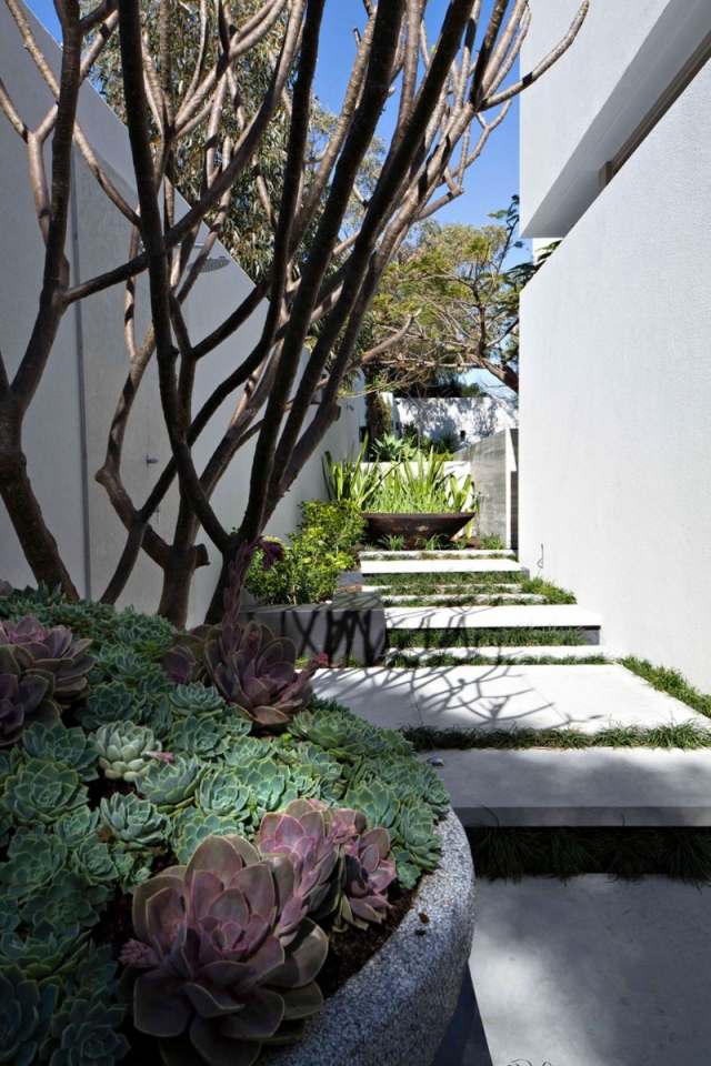 Garten-Gestaltung Blumenbeete wege-beton trittsteine Architektenhaus