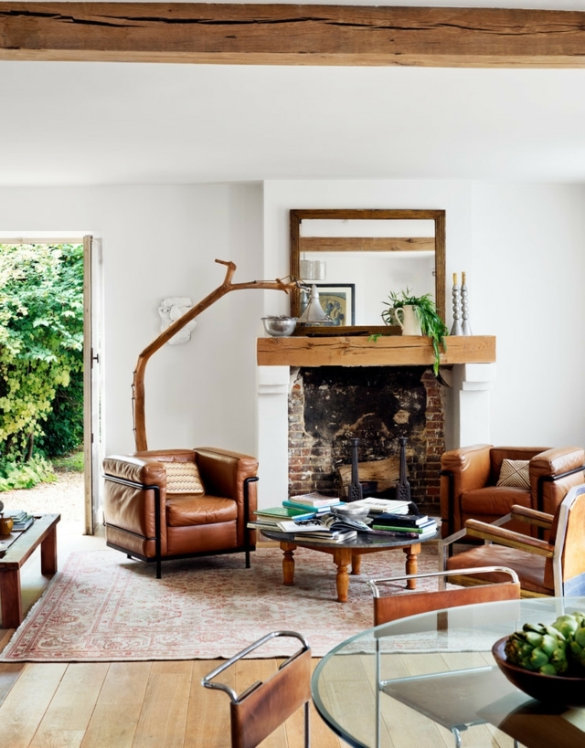 Wohnzimmer einrichten Sessel Kamin rustikal Landhausstil modern