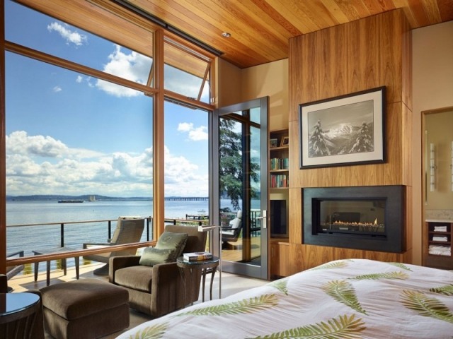 luxus schlafzimmer-mit panoramafenster kaminofen wandkamin-eingebaut