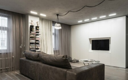 wohnzimmer-einrichtting-industriell-chic-holzboden-deckenleuchten-beton-optik