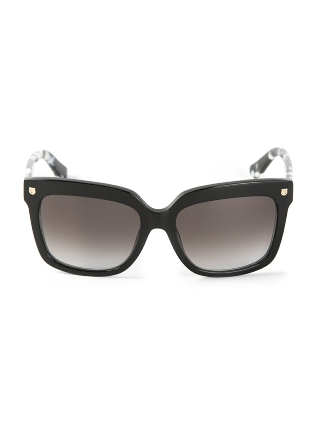 Designer-Sonnenbrille-gewölbter-Brillensteg-mit goldenen-Nieten