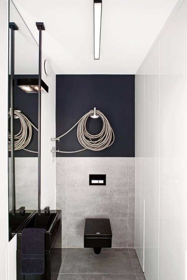 badezimmer-modern-einrichten-heizkoerper-design-interessante-form-schwarze-badmoebel