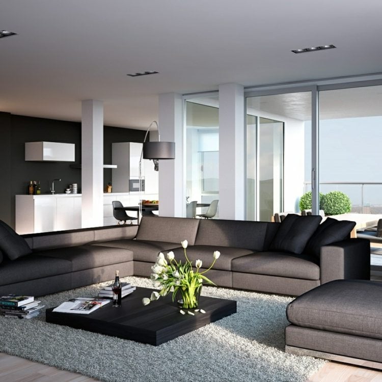 einrichten wohnzimmer modern couchtisch grau sofa kissen schwarz tulpen