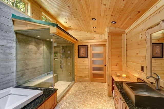 Badezimmer Granit Waschbecken Holzwände Kiesboden