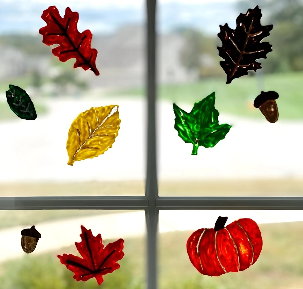 Mit Kindern Fensterbilder im Herbst basteln aus Fensterfarben