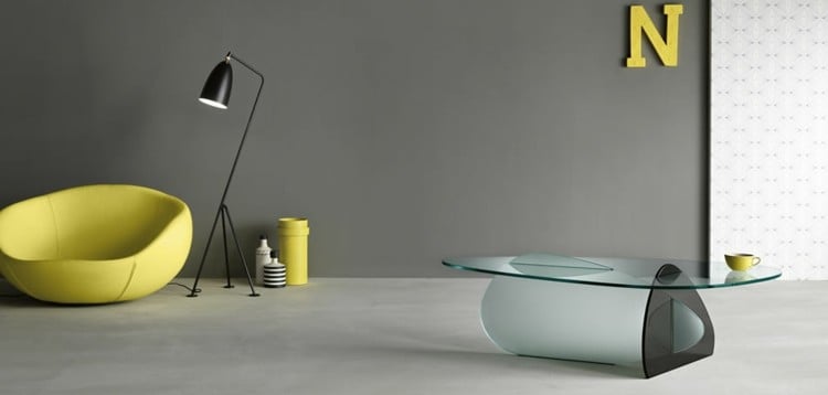 glastisch design modern-schwarz-transparent-oval-sessel-gelb-stehlampe