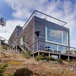 Einfamilienhaus Glasfronten Flachdach Holz Fassade