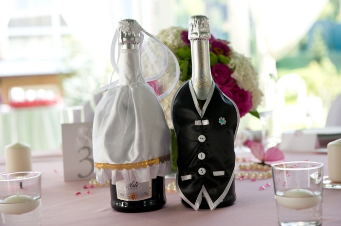 Hochzeit Tischdeko Ideen Champagne Flaschen verkleiden