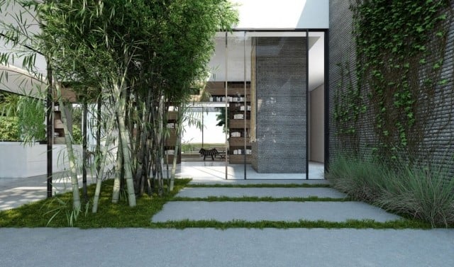 modernes-wohnhaus-haustuer-steinplatten-bambusstangen-rasen