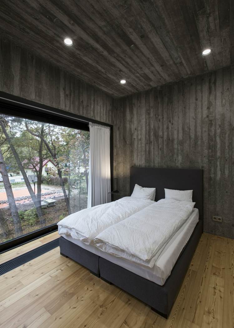 schlafzimmer beispiele monochrom beton wandgestaltung grau bett