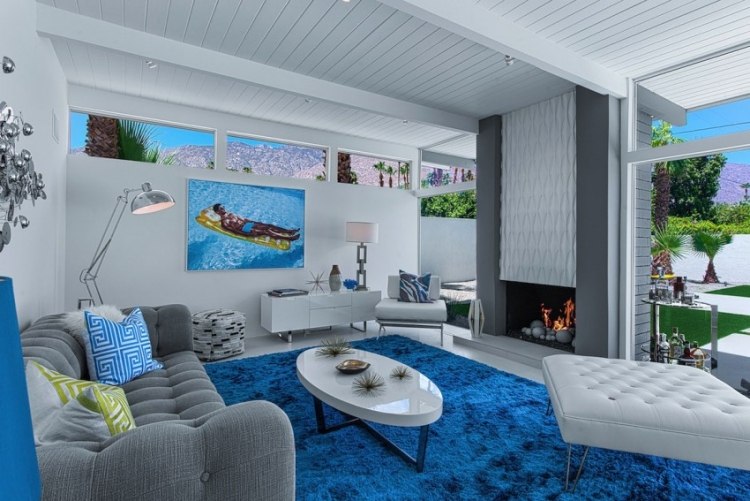wohnzimmer Einrichten mit Grau kamin-blauer-teppich-vibrant