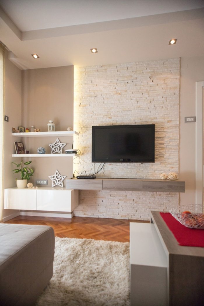 wohnzimmer-wohnwand-puristisch-beleuchtung-ziegel-textur-weiß
