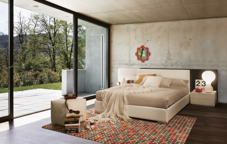 Schlafzimmer Ideen Sichtbeton Wand modern Teppich creme Doppelbett