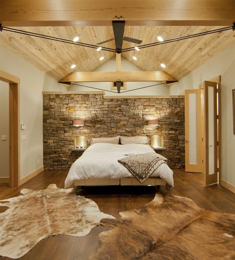 schlafzimmer ideen 2015 modern rustikal kombi stein wand felle holz akzente bett
