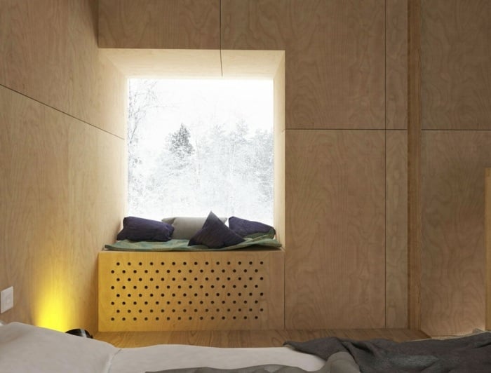 schlafzimmer ferienhaus winterurlaub leseecke ausblick wandverkleidung sperrholz