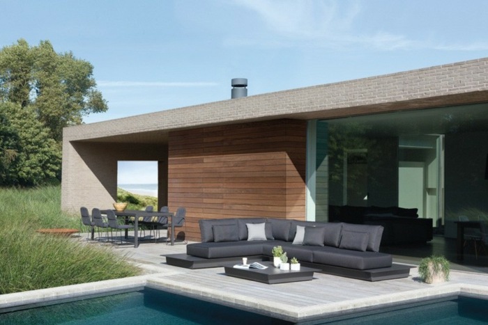 schwarzes sofa manutti möbel terrasse pool haus modern