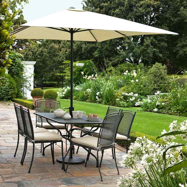 kettler-gartenmoebel-natural-design-organic-garden-furniture-that-has-modern-black-table-and-seat-arround-that-make-it-seems-modern-design-of-the-garden-with-stone-floor-inside-room-940x940