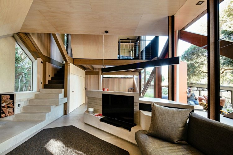 modernes interieur wohnzimmer fernseher lowboard treppe beton holz