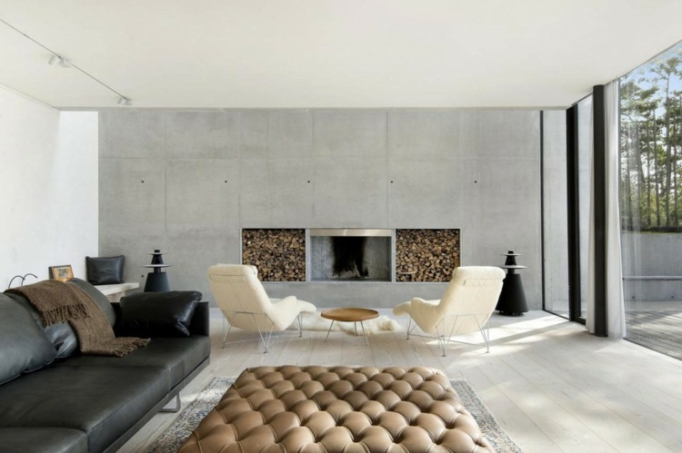 wohnzimmer design idee kamin holzscheite sitzbereich leder villa